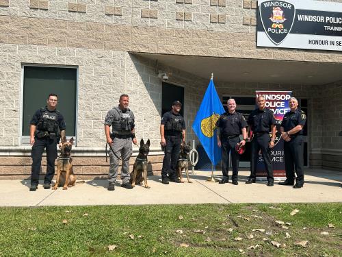 2024-09-04-update-1 Photograph of police dogs and officers.