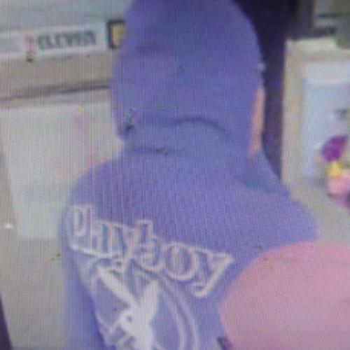 Image of suspect in purple hoodie