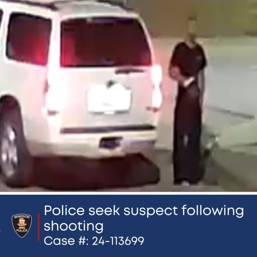 2024-09-23-update-4-image-1 Surveillance photo of shooting suspect standing near vehicle.